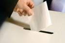 Generic image of a voter lodging their ballot paper.
