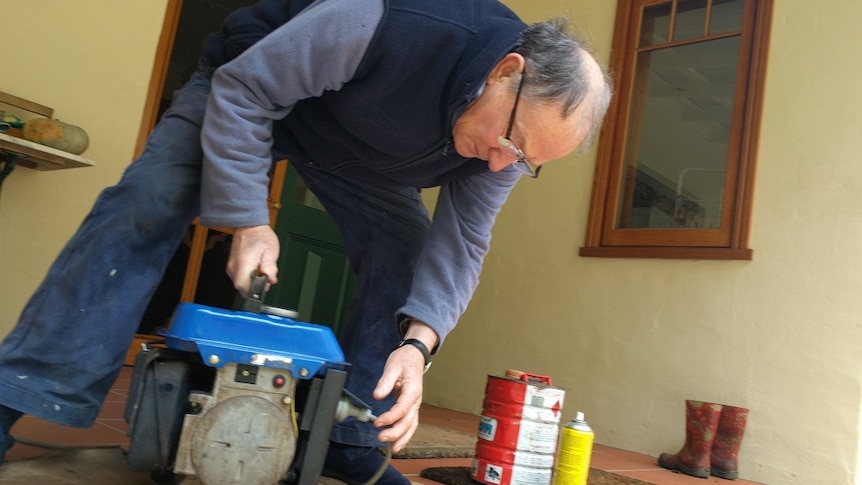 Mark Randell connects a generator.