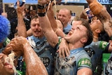 NSW Blues players celebrate State of Origin win in the changerooms