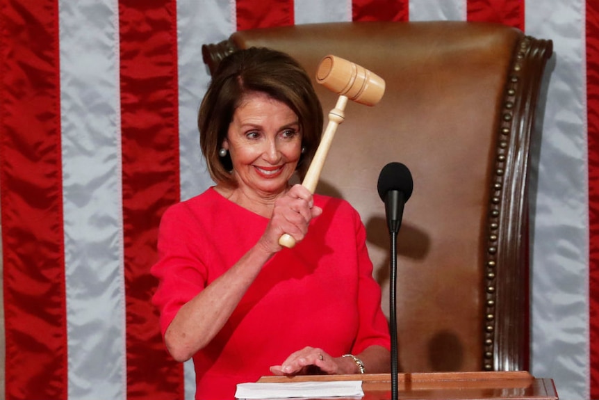 Nancy Pelosi wears a fuchsia dress in Congress