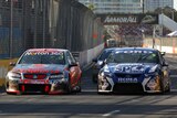 Jamie Whincup battles for position with Shane Van Gisbergen on the final lap at Surfers Paradise
