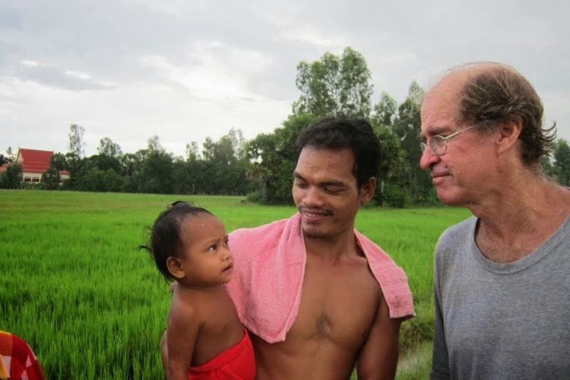 James Ricketson speaking with locals in Cambodia