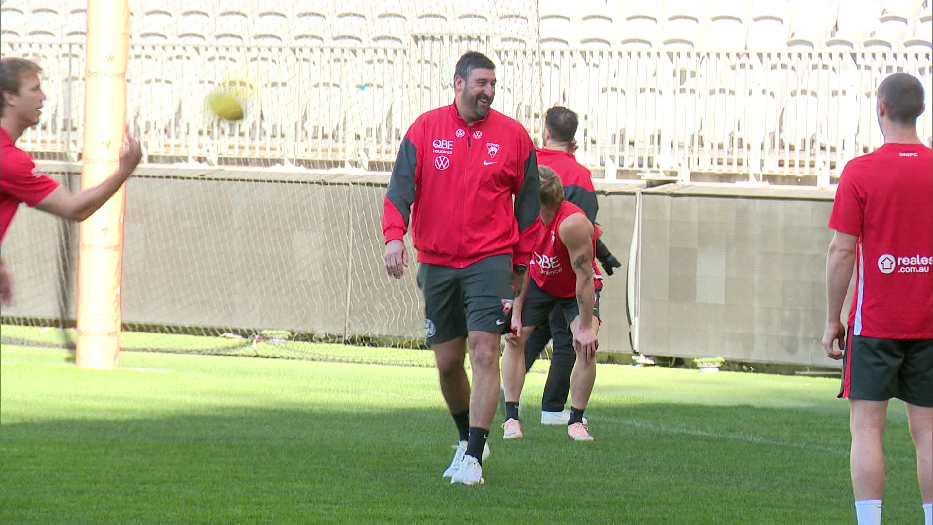 Dean Cox smiles as he conducts a training session with the Sydney Swans. 