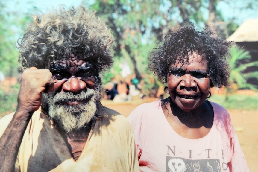 Two people smiling at the camera.