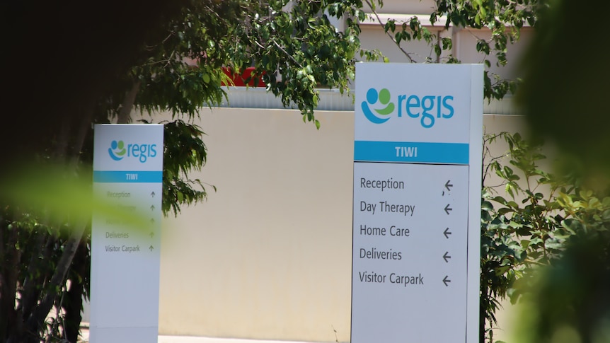 Signs pointing to sections of the Regis Tiwi Gardens aged care facility. 