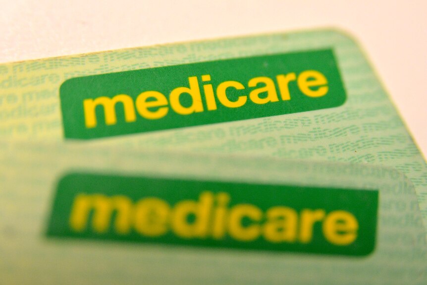 Medicare cards on a table.