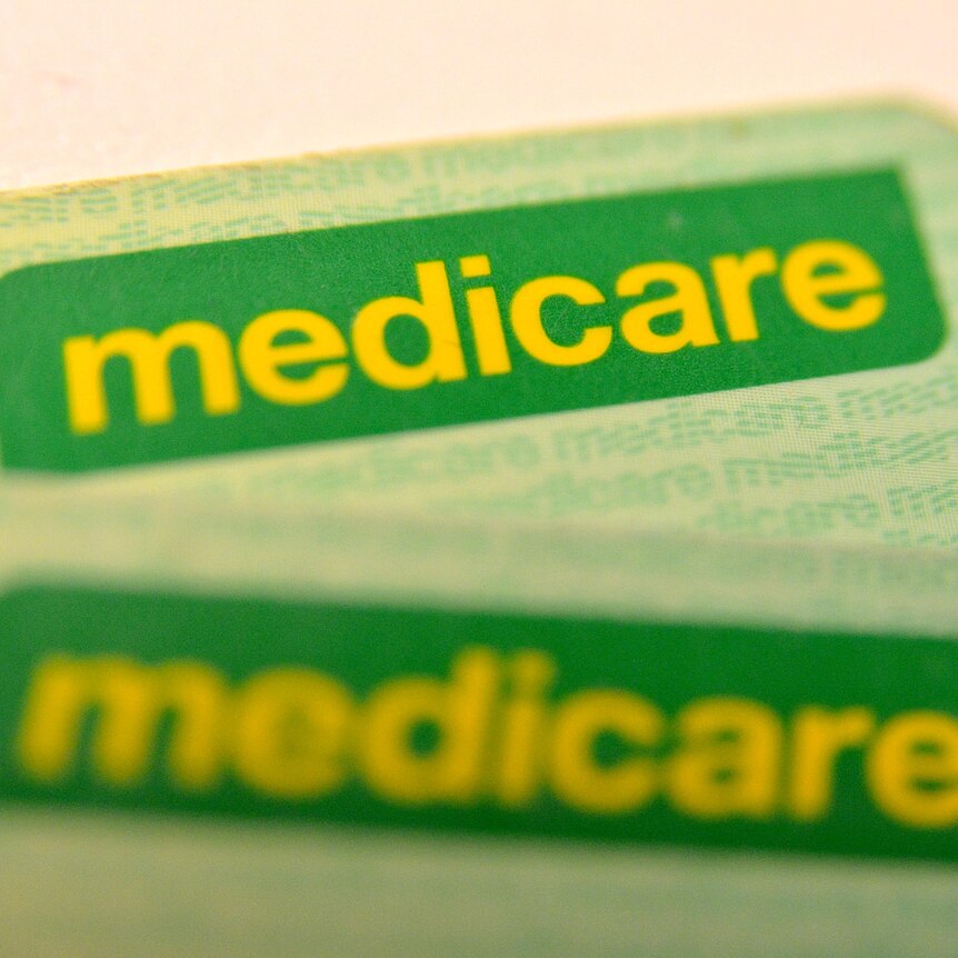 Medicare cards on a table.