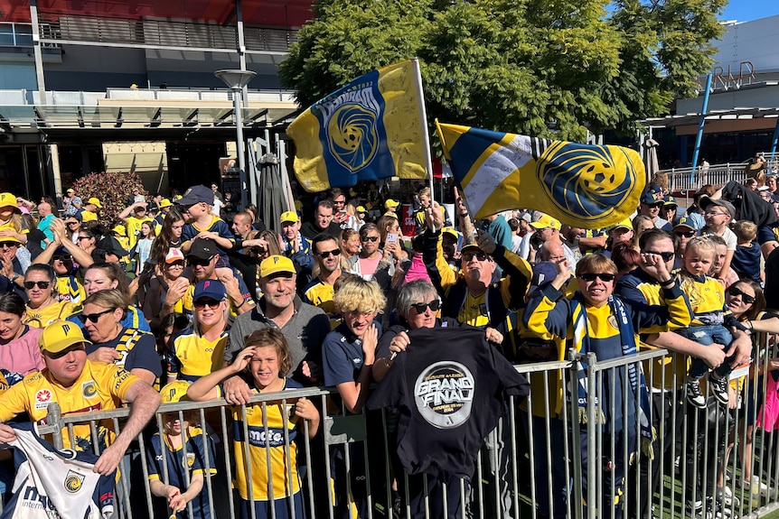 fans of the Central Coast Mariners celebrate their team's a-league grand final win