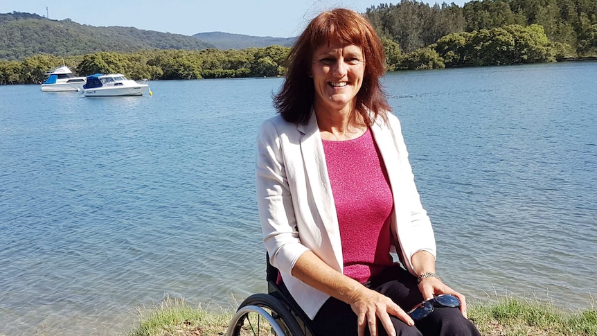 Paralympian Liesl Tesch sits by the water in her wheelchair.