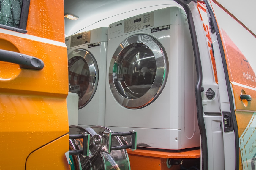 Each van holds two washing machines and two clothes dryers.