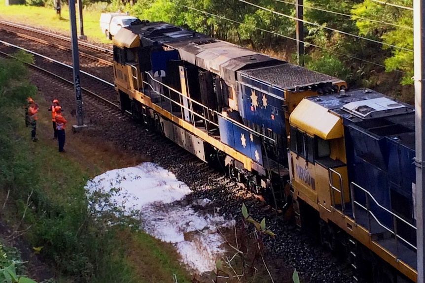 Firefighters near a freight train at Cardiff