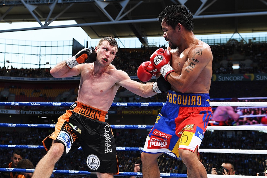 Two men boxing in a ring.