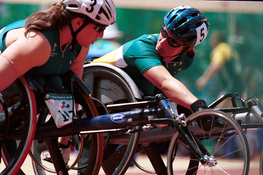 Australian wheelchair racers Louise Sauvage and Christie Skelton in uniform and on the track at the 2000 Sydney Paralympic Games