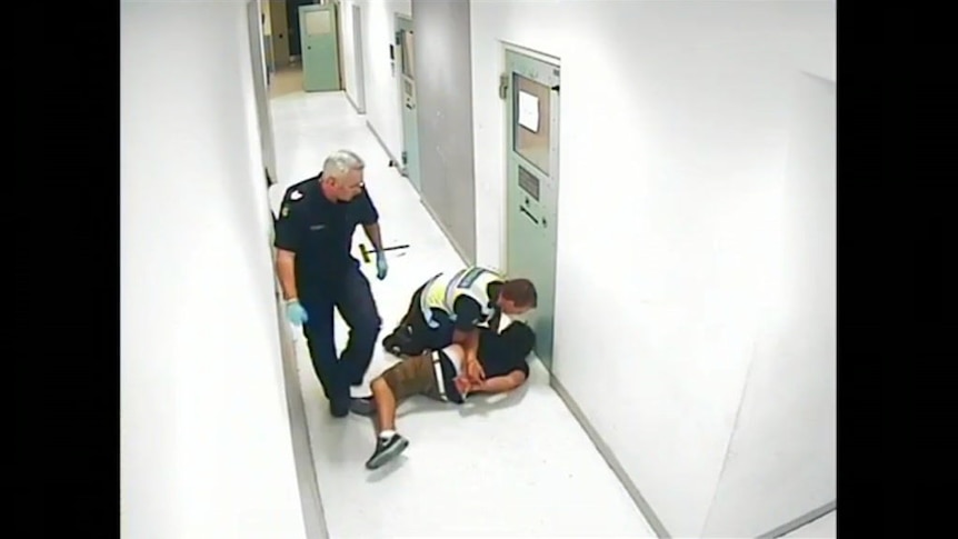 A security camera recorded a police officer throwing a Bendigo prisoner into a door