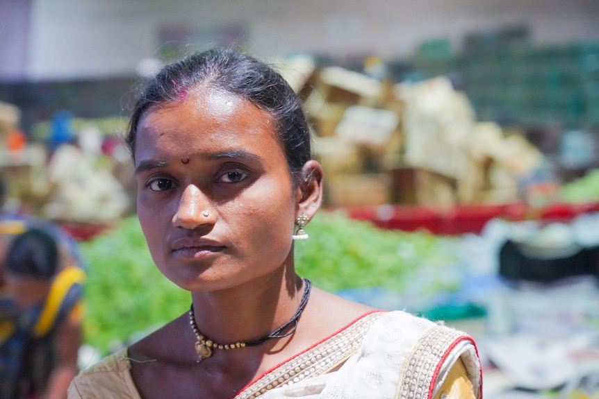 A young Indian woman at a food market