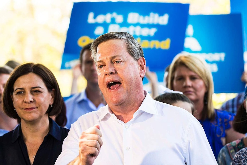 Queensland LNP leader Tim Nicholls speaks with a clenched fist to his supporters in his Brisbane electorate of Clayfield.