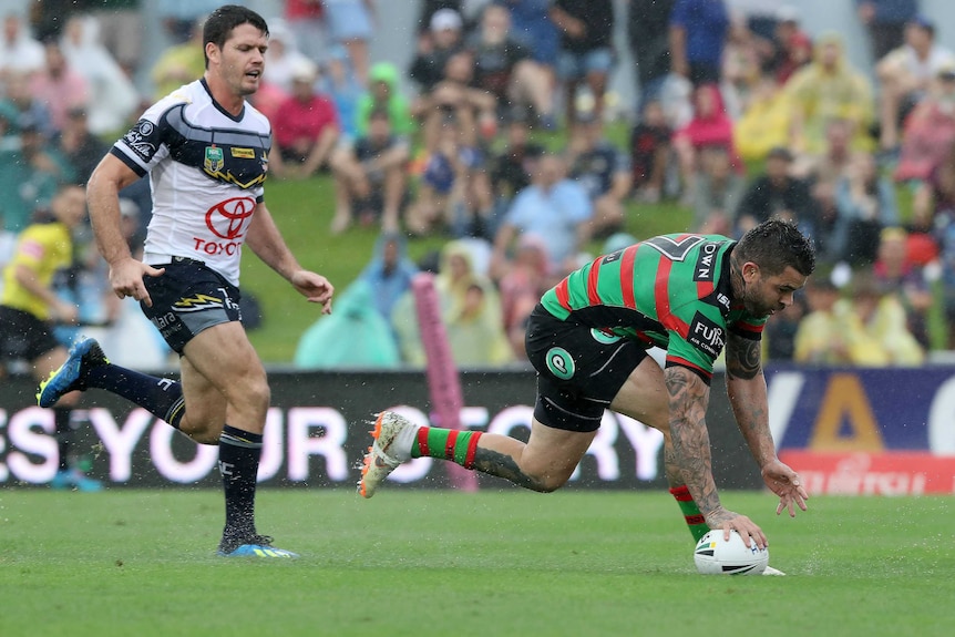 Adam Reynolds scores a try against North Queensland in the rain