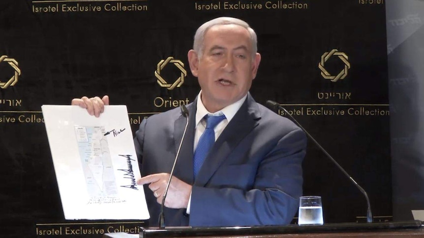 Benjamin Netanyahu points to a map with the word "nice" written in permanent marker.