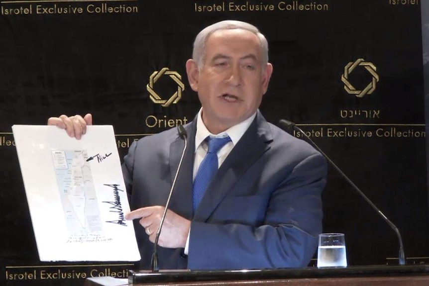 Benjamin Netanyahu points to a map with the word "nice" written in permanent marker.