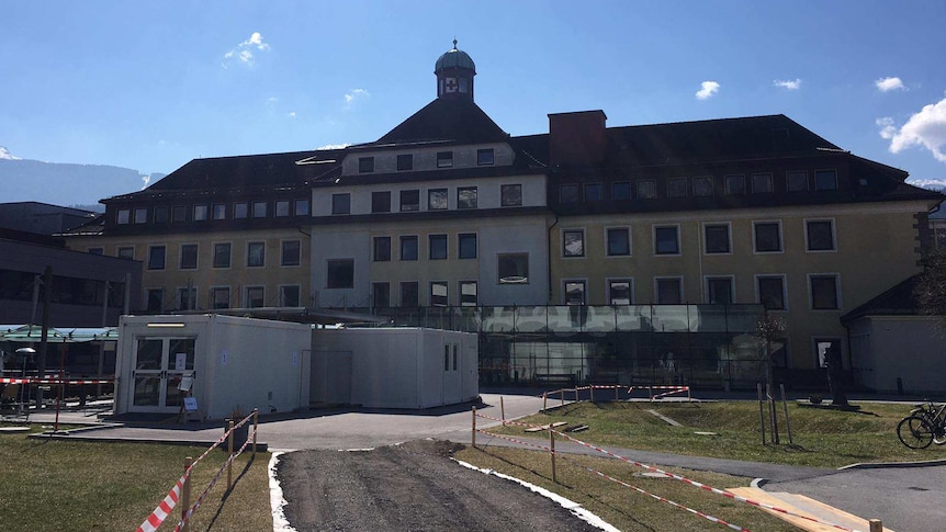 Shipping containers in the car park of an Austrian hospital.