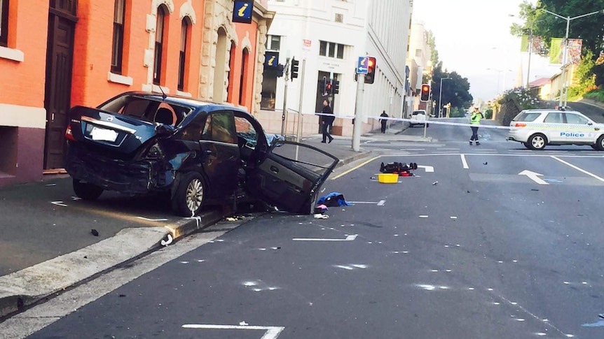 Dark blue car smashed on side of Davey Street Hobart.