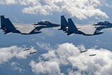 US and South Korean fighter jets drop bombs over the Korean peninsula during joint drills.