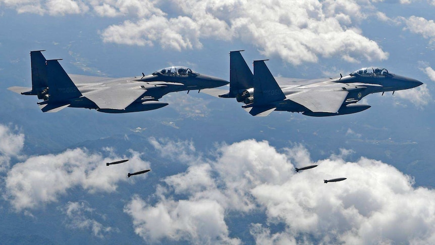 US and South Korean fighter jets drop bombs over the Korean peninsula during joint drills.