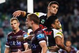 Panthers players celebrate as Manly players complain to the ref.