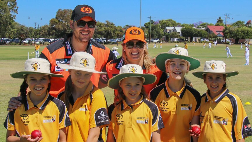 Roy McNamara-Smith (back left) with girls from the Perth Scorchers Girls Cricket League