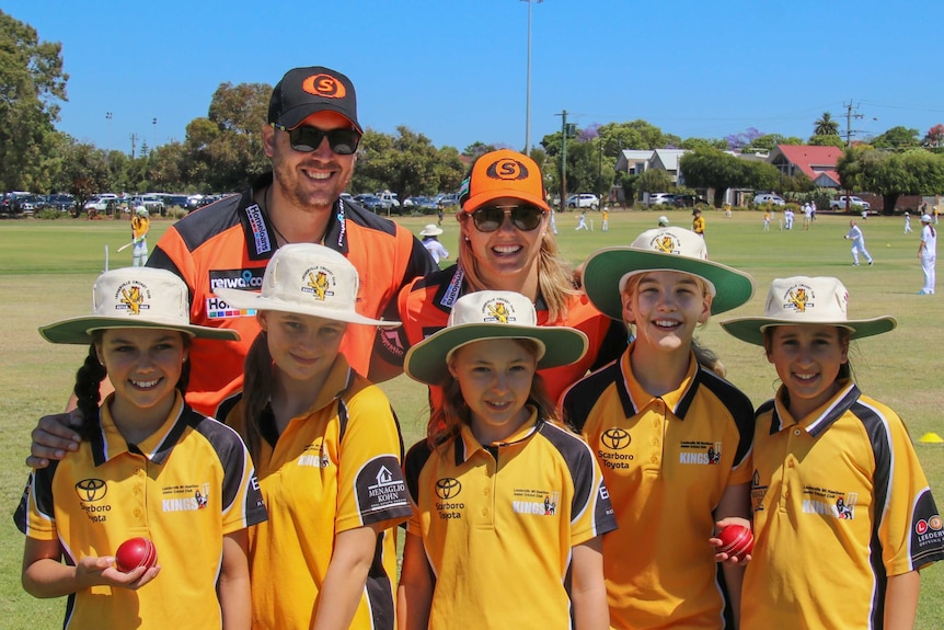 Roy McNamara-Smith (back left) with girls from the Perth Scorchers Girls Cricket League