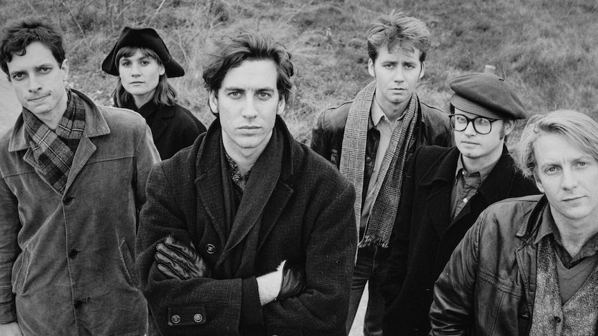 black and white photo of indie rock band the triffids standing in a field