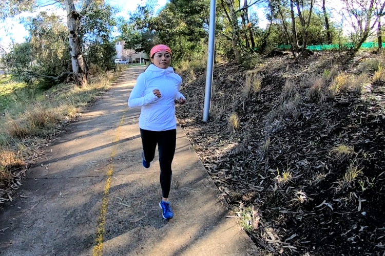 A woman running in a track