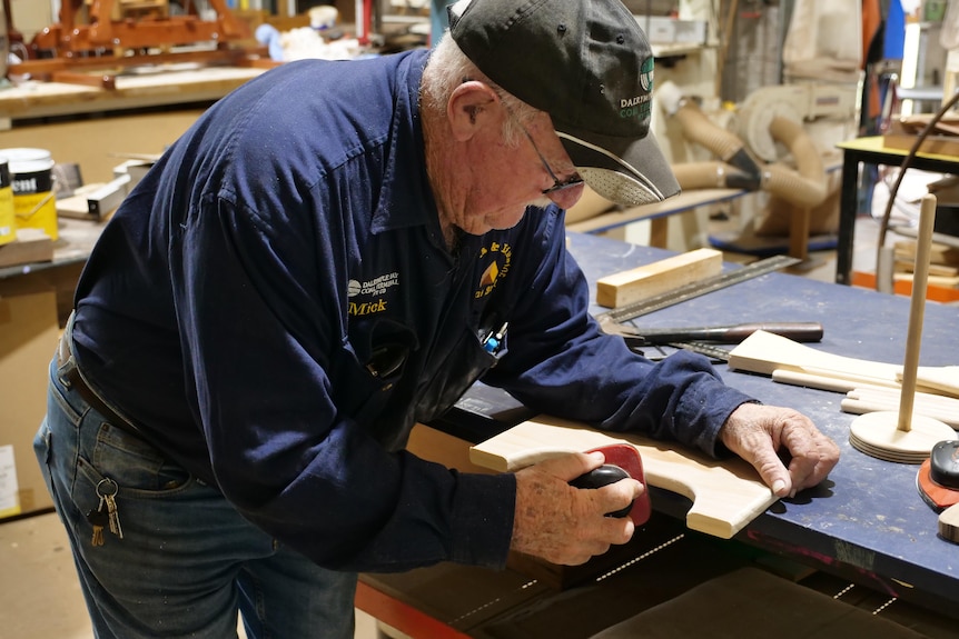 Man working at tool bench. 