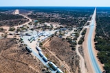 A drone photograph of a remote roadhouse on the Nullarbor