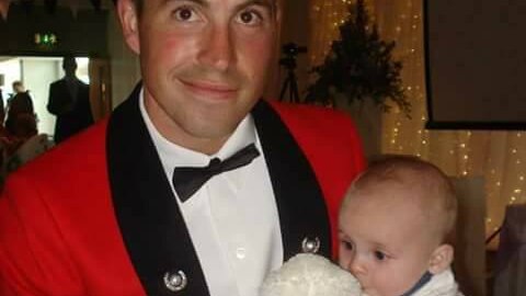 Nathaniel Beesley, former Royal Marine, with son.