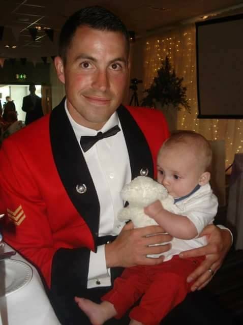 Nathaniel Beesley, former Royal Marine, with son.