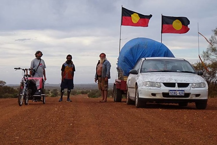 Clinton with his support car and team.