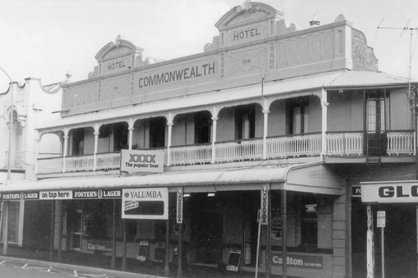 A black and white photo goo the pub.