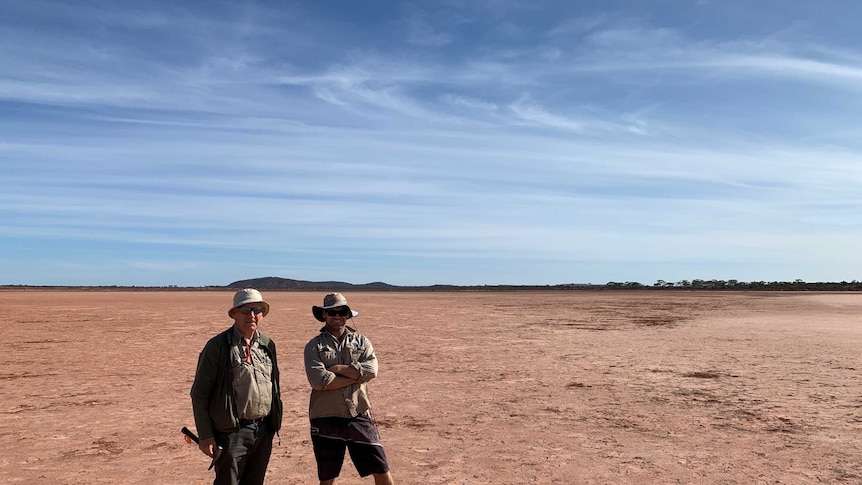 Two male geologists standing in outback Australia.