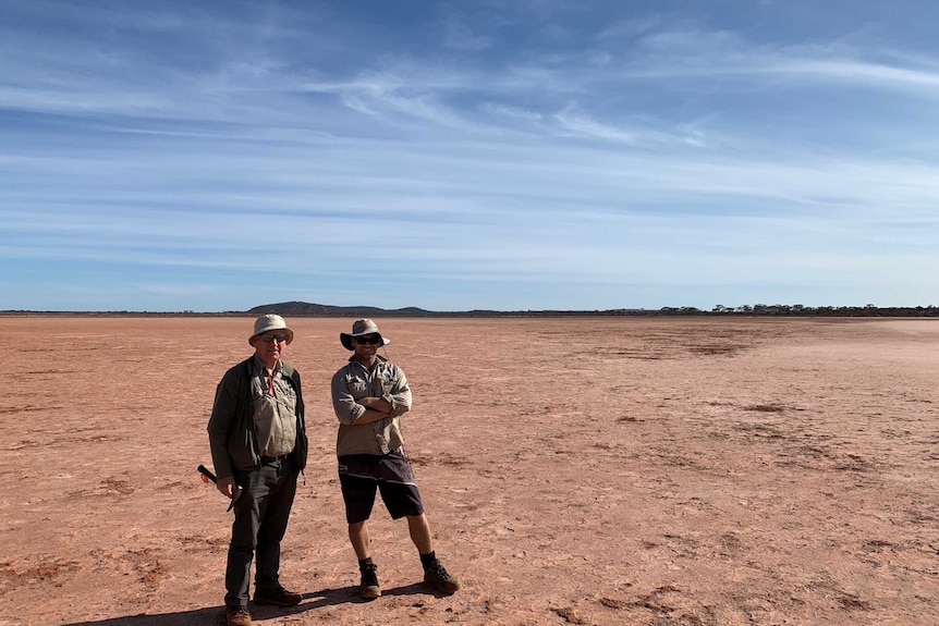 Two male geologists standing in outback Australia.