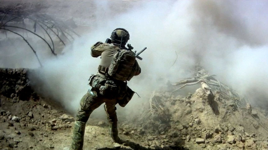SAS Soldier during a raid on a mud bunker in Afghanistan in 2012.