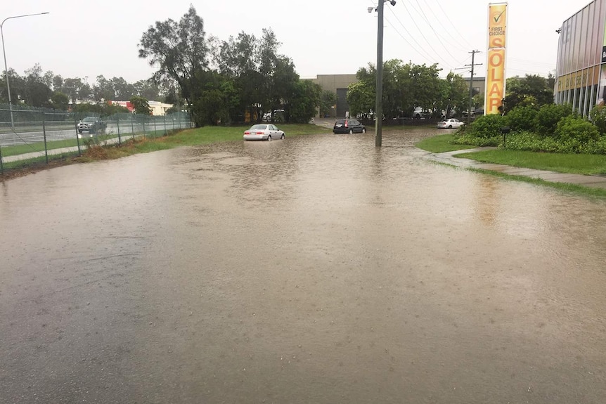 Flooded Hutchinson Street at Burleigh Heads after deluge.
