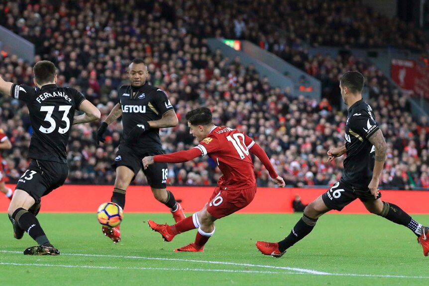 Liverpool's Philippe Coutinho scores against Swansea at Anfield on December 26, 2017.