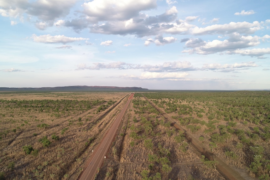 drone shot of road cutting through remote Kimberley countryside