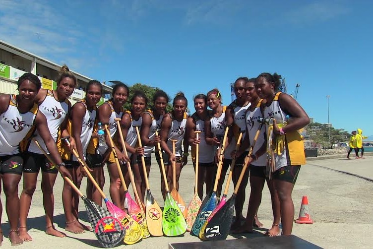 The PNG crew pose after winning gold.