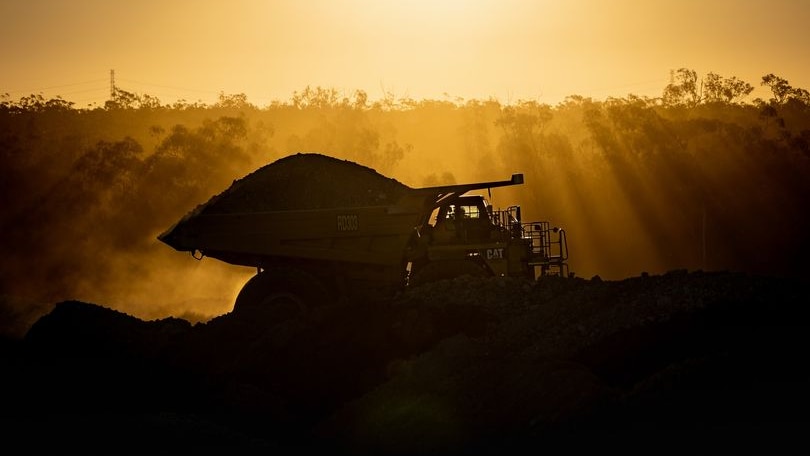 A mining truck at dusk