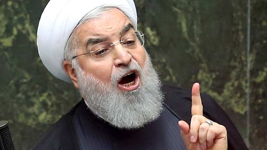 Iranian President Hassan Rouhani speaks in front of Iran's parliament