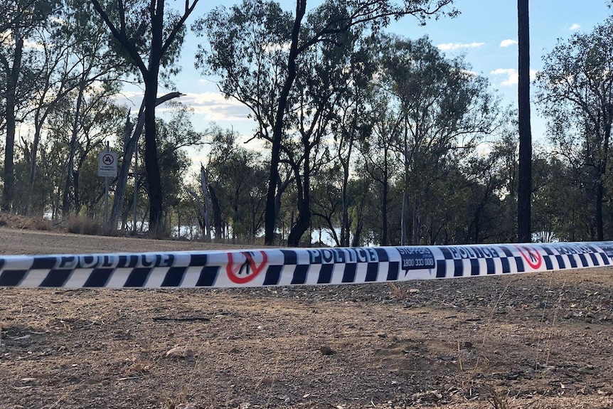 Police tape at Wuruma Dam near Eidsvold where the bodies of two men were found in the water.