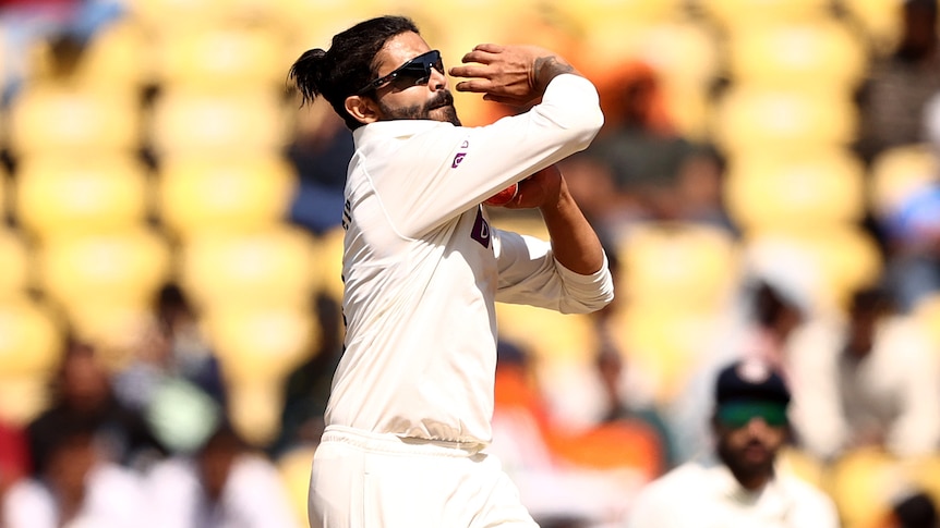 An Indian male spinner bolws a ball during the first Test against Australia in Nagpur.