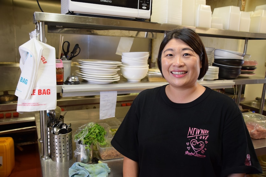 Jean Tsai smiles while standing in kitchen at Phuket Kitchen Thai Restaurant in Albany Creek